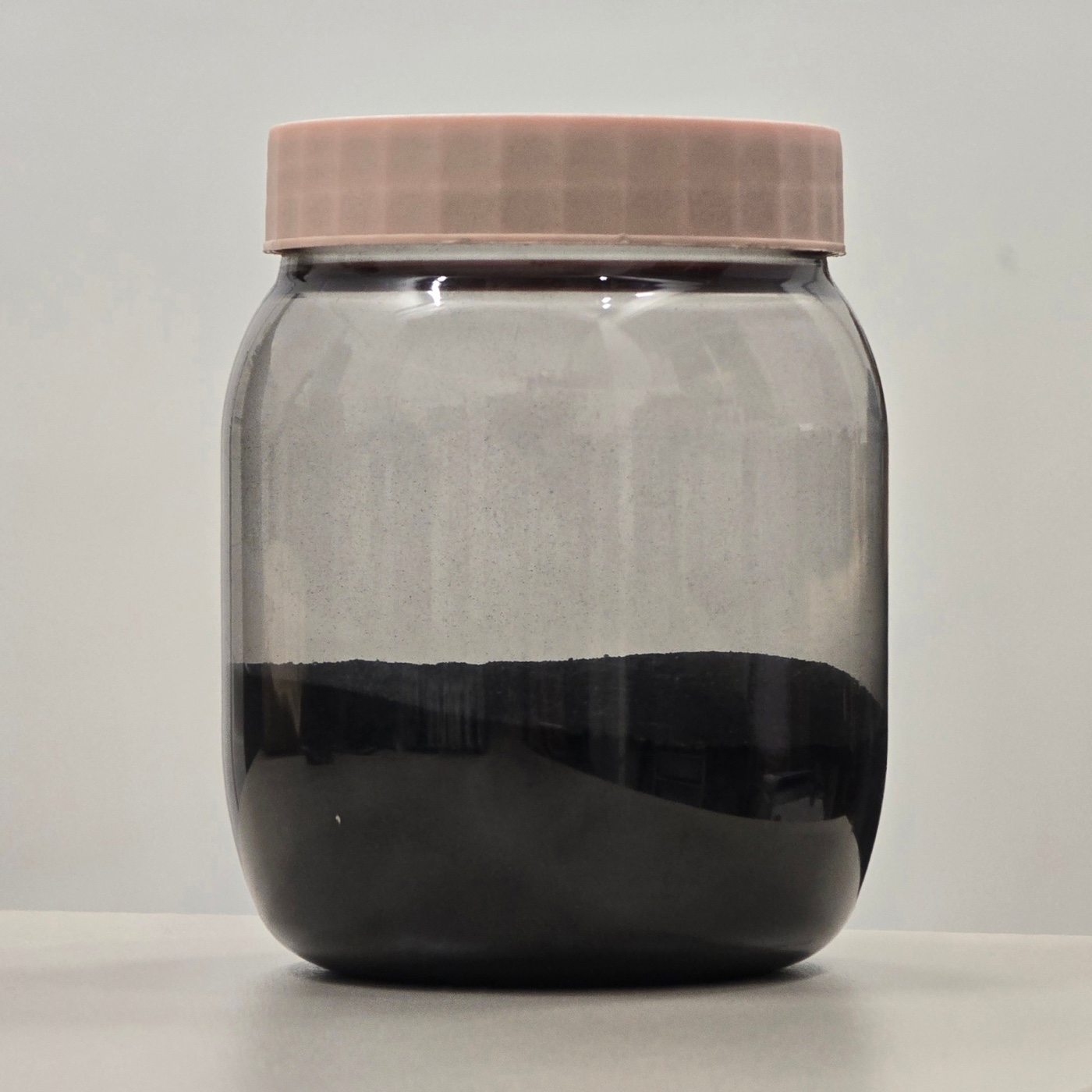 NCF powder in a glass jar